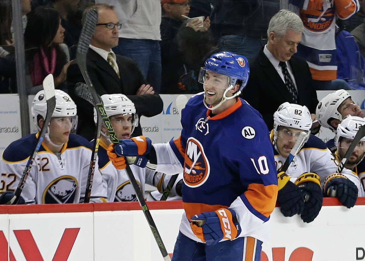New York Islanders' Alan Quine (10) celebrates after scoring a goal during the third period of an NHL hockey game against the Buffalo Sabres on Saturday, April 9, 2016, in New York. The Sabres won 4-3. (AP Photo/Frank Franklin II)