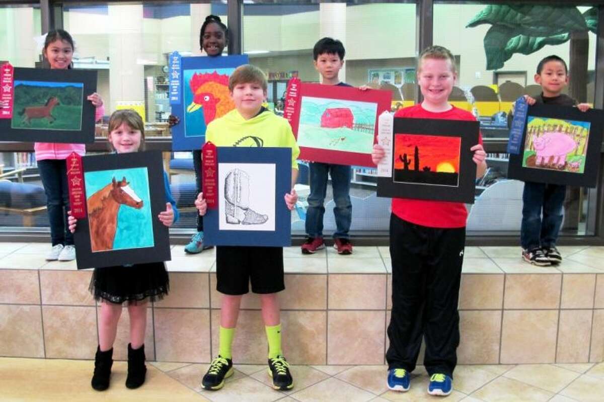Buckalew students pose for a picture with their rodeo artwork