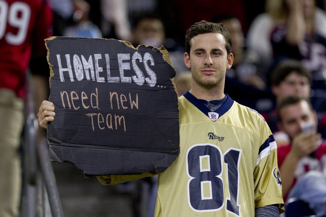 Carson councilman with split Chargers/Raiders jersey (Photo)