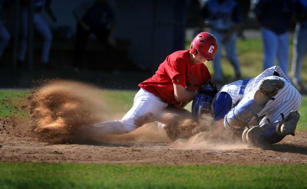 Fairfield Ludlowe catcher Rob Ferrara forces Greenwich's Callum Lawson out at home plate during their game Wednesday May 5, 2010 at Kiwanis field in Fairfield.
