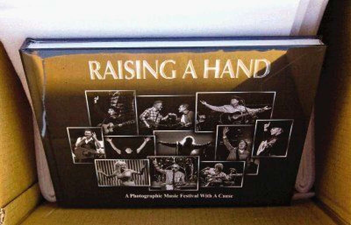 The proceeds of the photo book created by photographer Dave Clements and musician Kevin Black, “Raising A Hand,” go toward research for Rett Syndrome a degenerative neurological disorder. The book features photos of artists from Sir Paul to Willie Nelson to George Strait to Charlie Daniels.