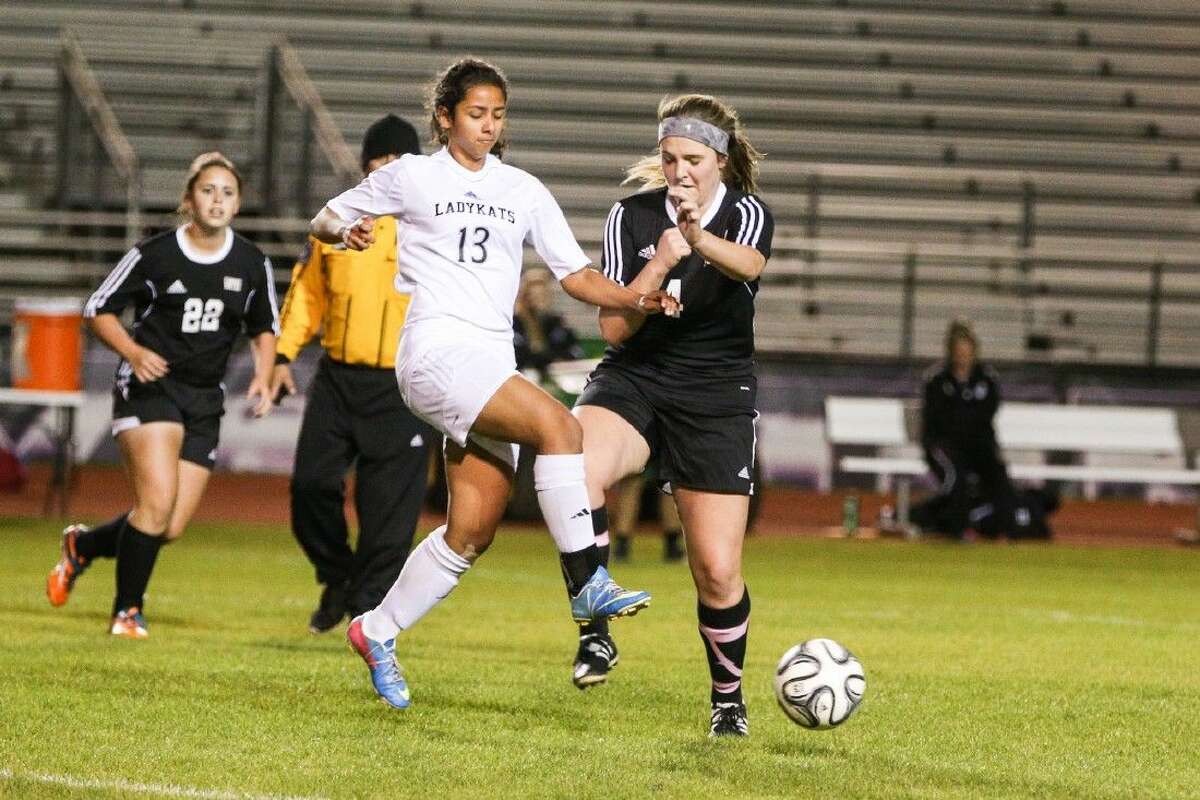 Willis' Crisely Pavon (13) battles for control of the ball with Conroe's Madison Weddel (4) during the high school girls soccer game on Tuesday, January 19, 2016, at Lynn Lucas Middle School. To view more photos from the game, go to HCNPics.com.