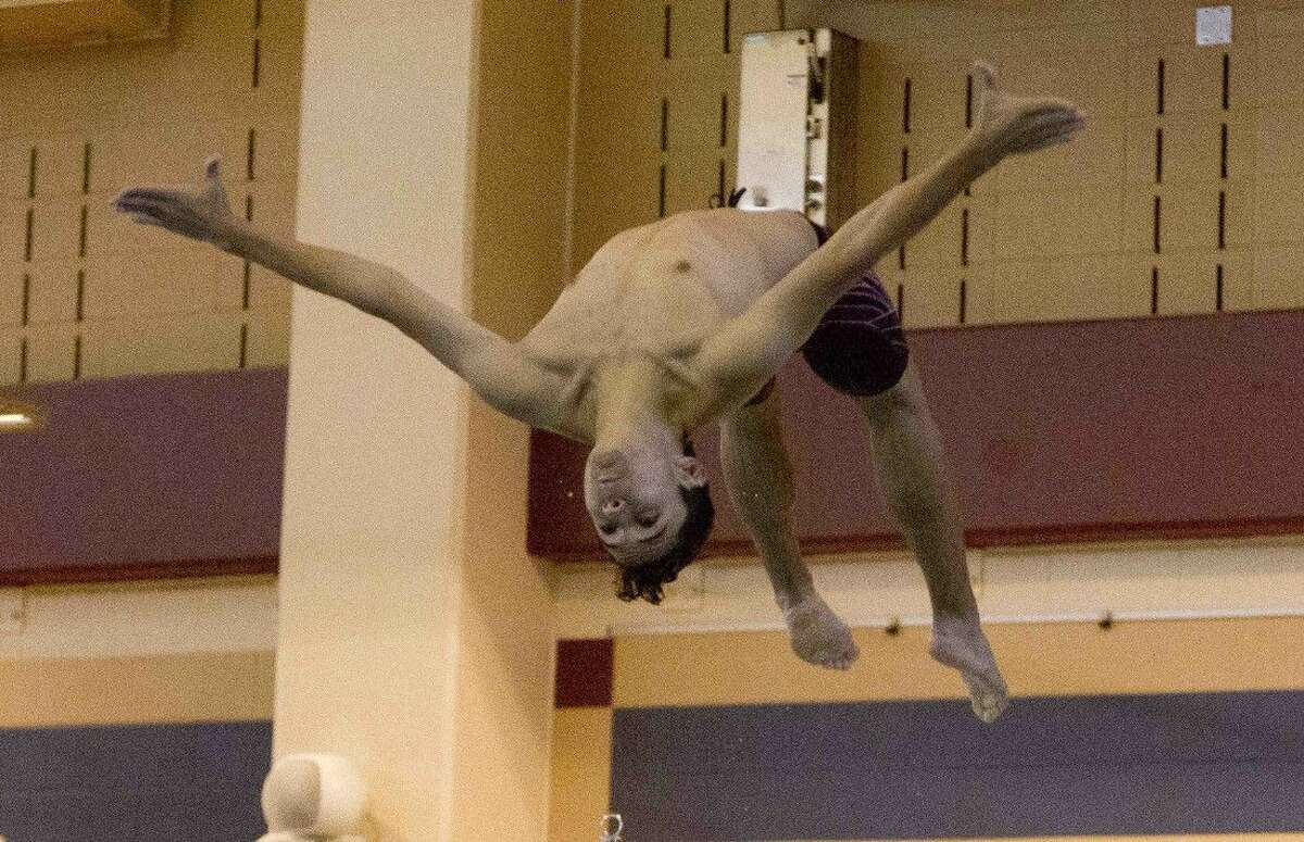 Magnolia West’s Robert Bunn competes in the District 20-5A dive meet in Friday in Shenandoah.