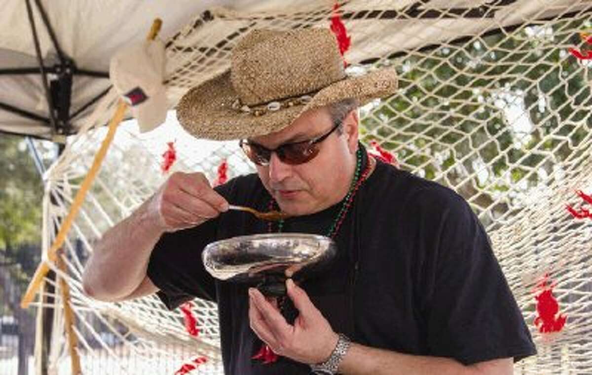 John Martin tastes his chili during a chili cook-off Saturday in downtown Conroe. Participants competed for points given by the Chili Appreciation Society International to earn a place at the 2014 Original Terlingua International Championship Chili Cook-off. To view or purchase this photo and others like it, visit HCNpics.com.