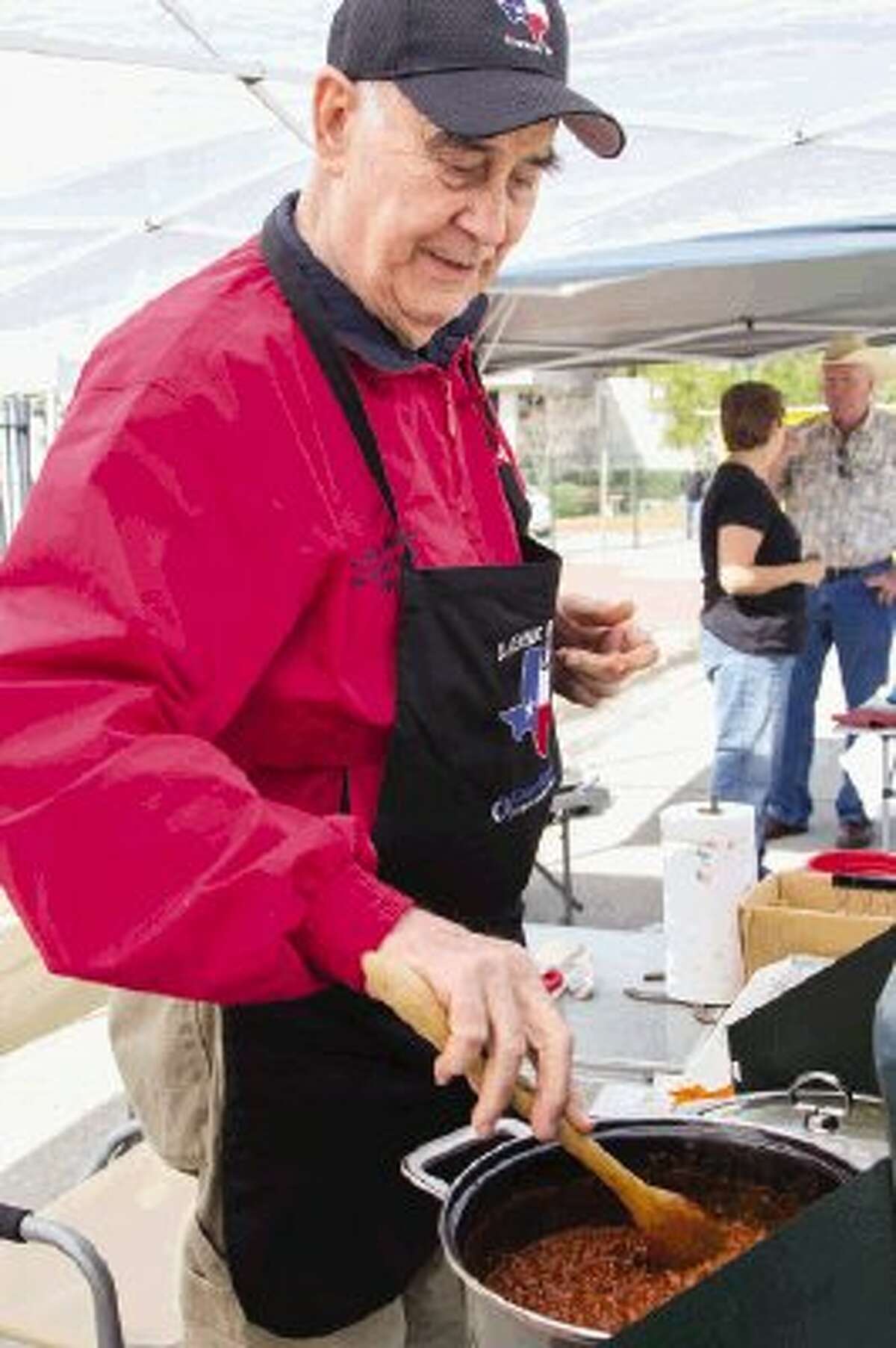 John Billy Murray of Houston competes in the “Boogie On The Blacktop” chili cook-off Saturday in downtown Conroe. Participants competed for points given by the Chili Appreciation Society International to earn a place at the 2014 Original Terlingua International Championship Chili Cookoff. To view or purchase this photo and others like it, visit HCNpics.com.