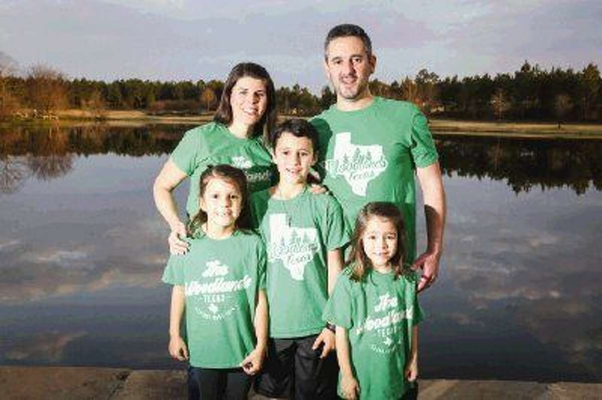 Ten-year-old Cody Peters, center, created Woodlands Shirts with the help of his father Tim, and eventually his mother Meagan, and sisters Carly, 7, and Campbell, 6 became a part of the project as well.