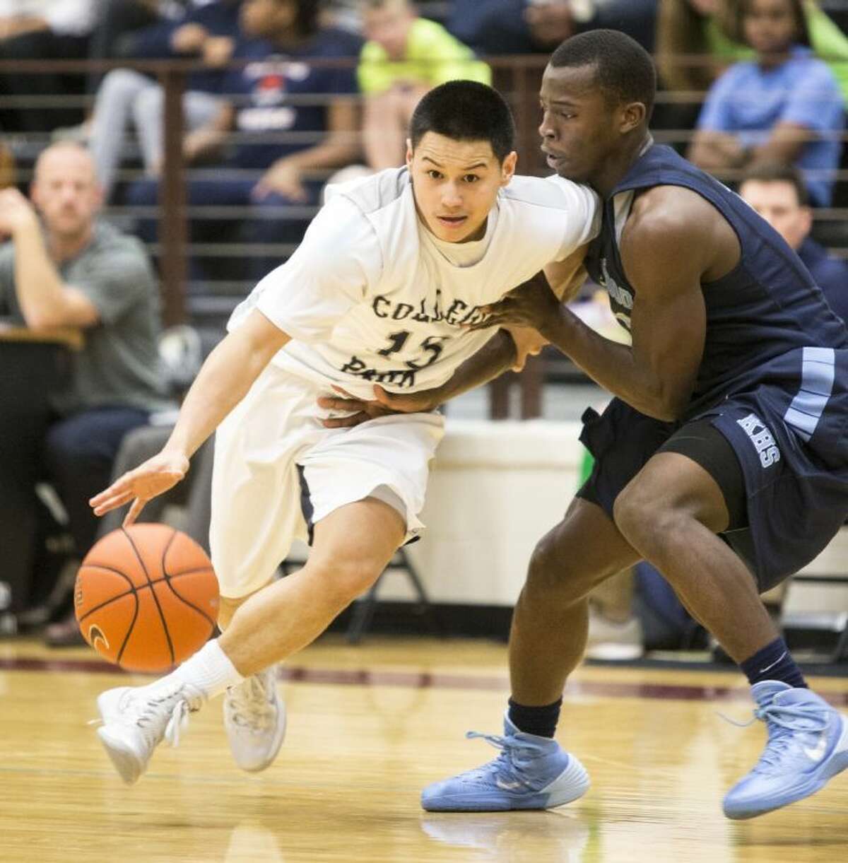 College Park’s Keanu Andaya looks for an opening in the Cavs’ 43-37 victory over Kingwood on Tuesday night.