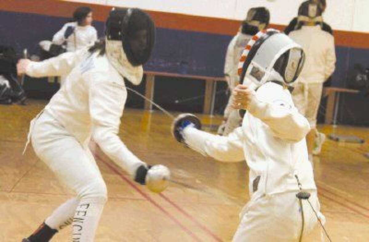 Jessica Thow, left, fences with Samantha Gaylor Feb. 5 at Alliance Fencing Academy located in Oak Ridge North.
