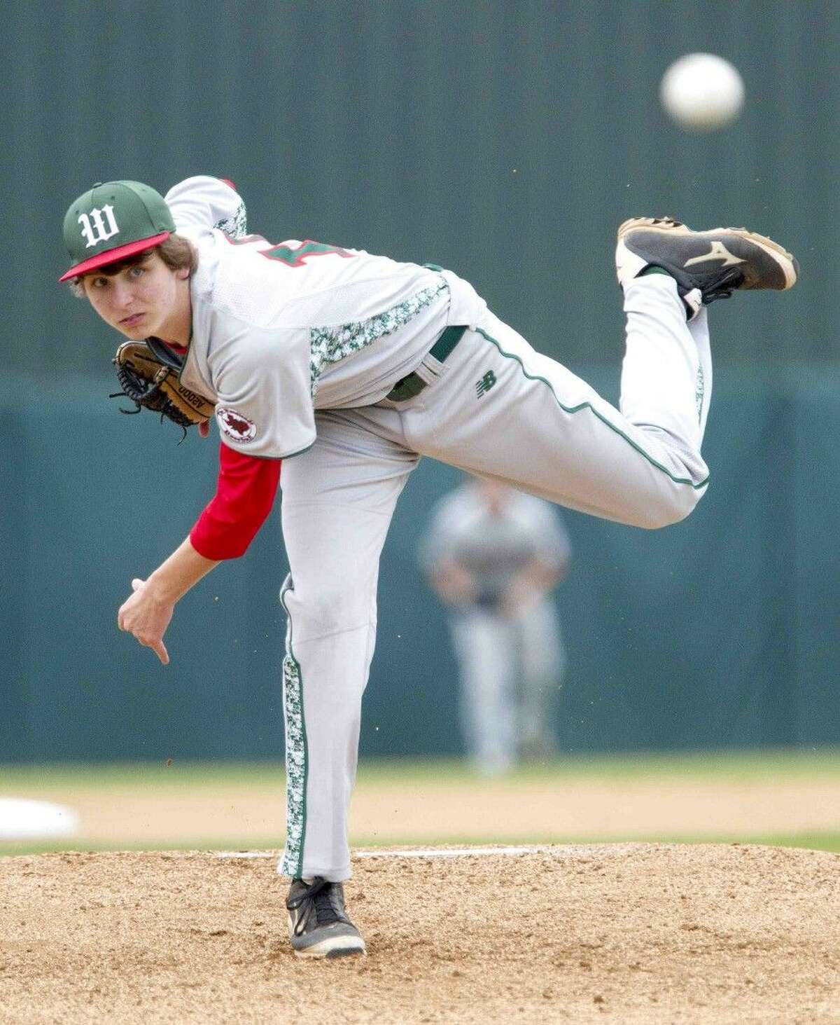 The Woodlands pitcher Steven Beard throws the ball against Richmond Foster. The Woodlands won 10-3.