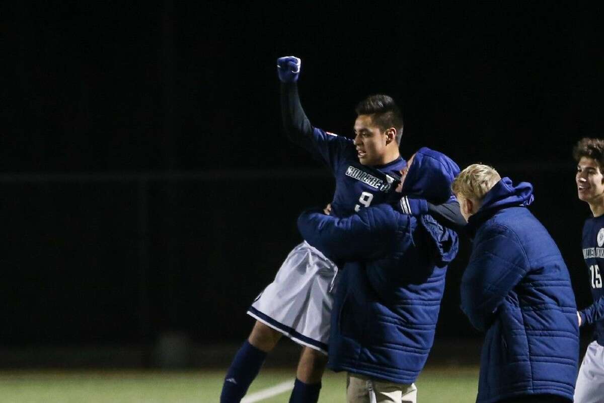 College Park’s Rodrigo Perez (9) celebrates after scoring a goal against The Woodlands during the high school boys soccer game on Friday at Woodforest Stadium.