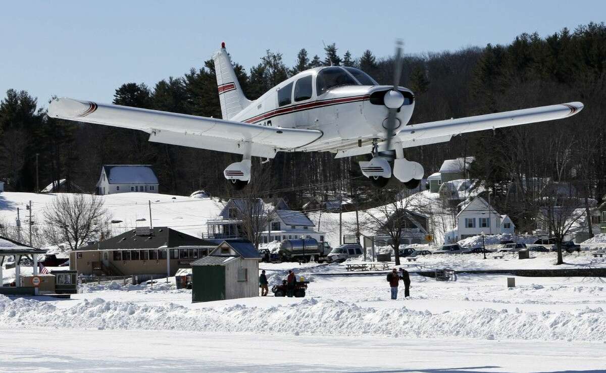 A plane lands on Lake Winnipesaukee.