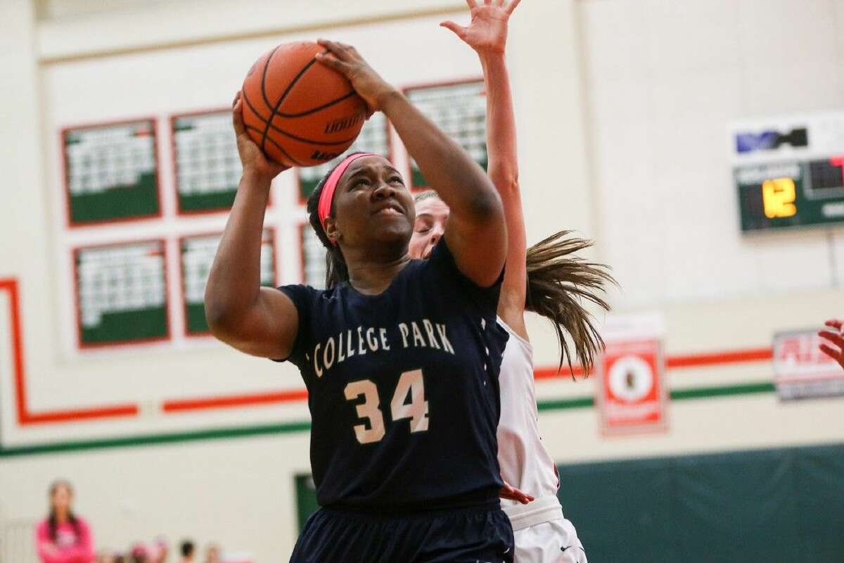 College Park's Angela Wadley (34) shoots for the basket during the high school girls basketball game against The Woodlands on Tuesday, Feb. 2, 2016, at The Woodlands High School. To view more photos from the game, go to HCNPics.com.