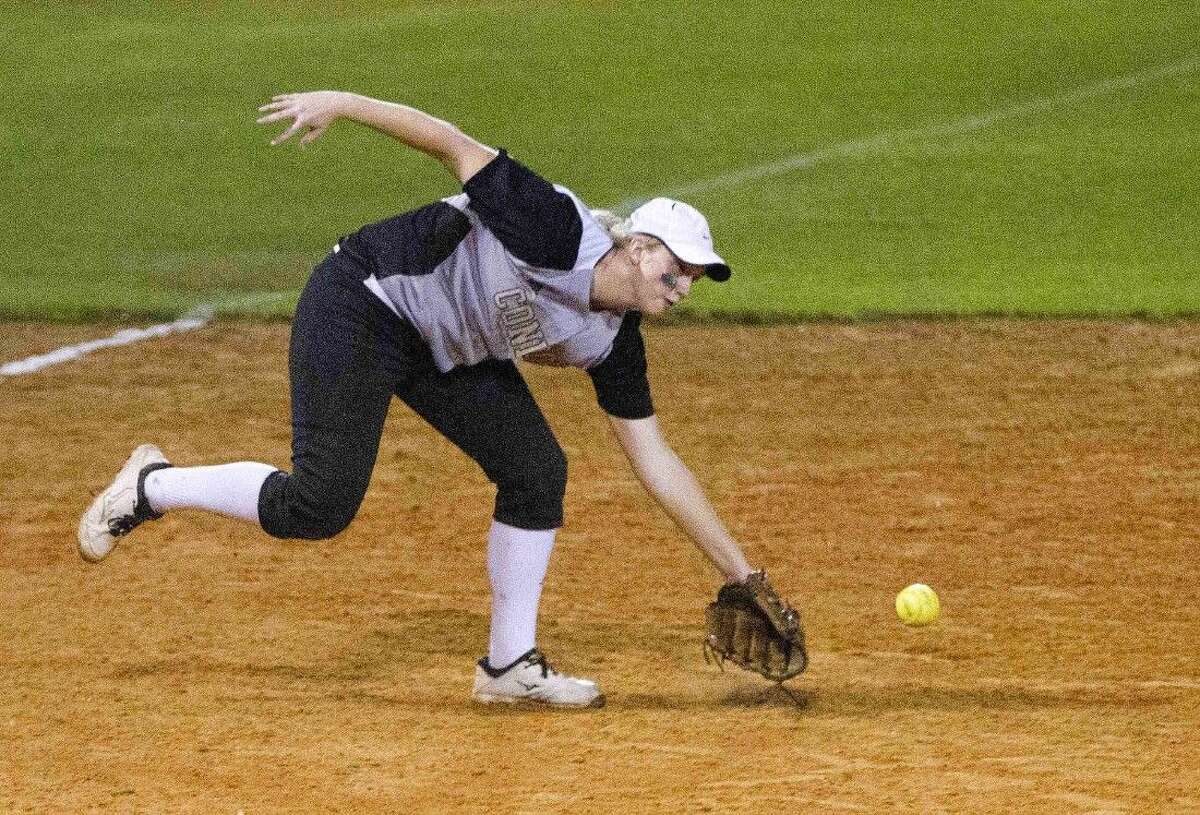 Conroe third baseman Katilyn Adams misses a ground ball during a softball game against Oak Ridge Tuesday. To view or purchase this photo and others like it, visit HCNpics.com.