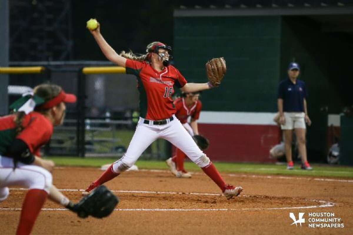 The Woodlands’ Emily Langkamp winds up for a pitch against Atascocita during the high school softball game on Tuesday at The Woodlands High School.