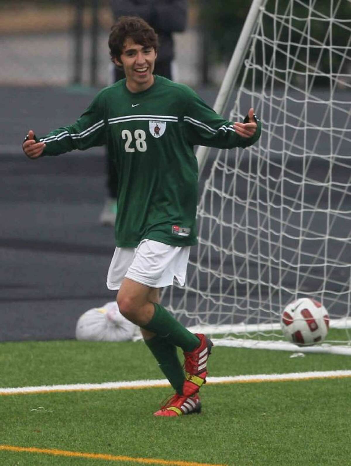 The Woodlands’ Marcelo Tamez celebrates after scoring a goal during a District 14-5A match on Wednesday at Buddy Moorhead Memorial Stadium. To view or purchase this photo and others like it, visit HCNpics.com.