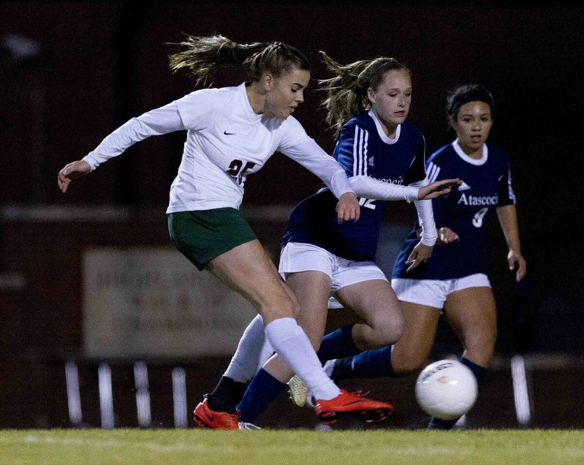 The Woodlands forward Katie Krotee puts a shot on goal during the first period of a District 16-6A girls soccer game Friday. To purchase this photos, and others like it; go to HCNpics.com.