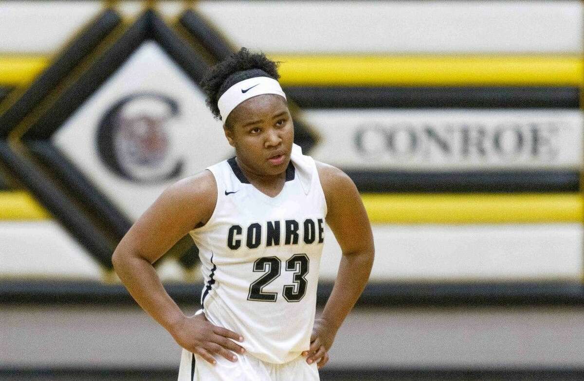 Conroe point guard Erica Powell reacts after a foul late in the fourth quarter of a District 16-6A girls basketball game Friday. Kingwood defeated Conroe 48-32. To purchase this photos and others like it, go to HCNpics.com.