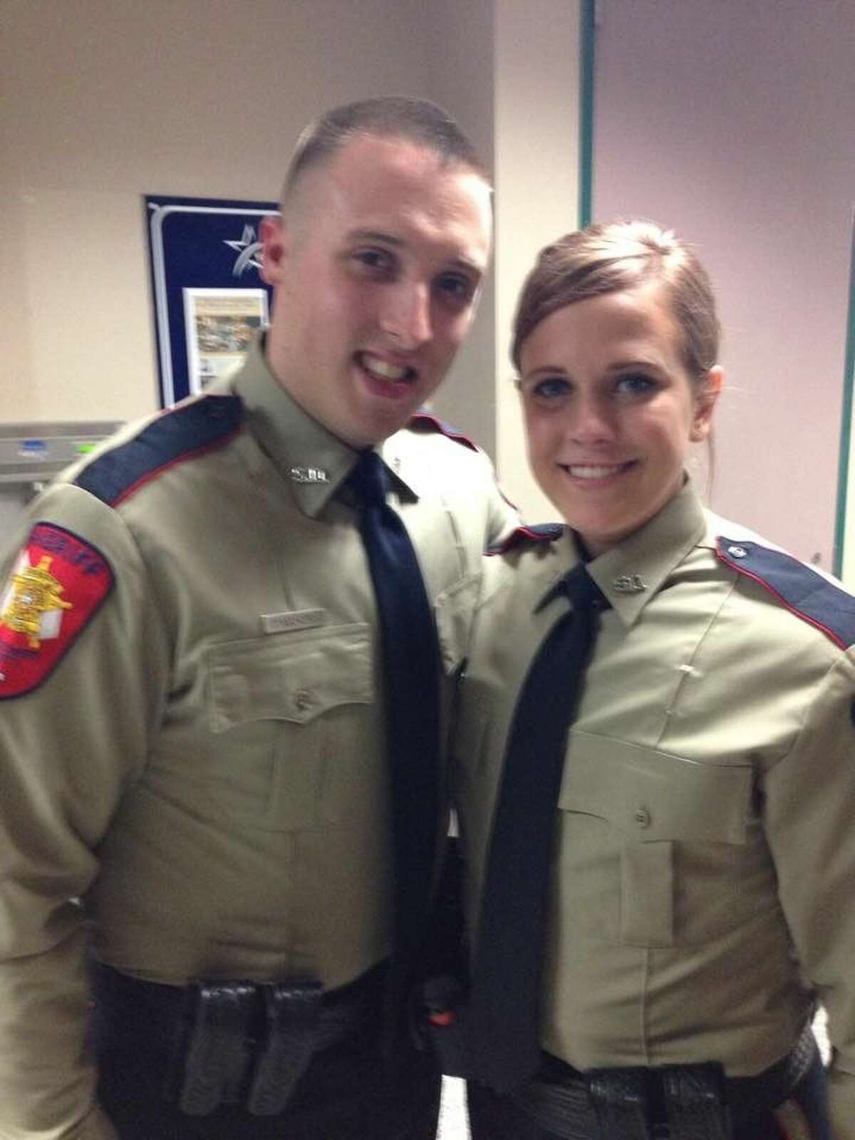 Catherine Breeding poses with fellow police academy graduate last fall. Breeding, 21, was killed Thursday, Jan. 29, 2015, in motorcycle crash in Conroe.