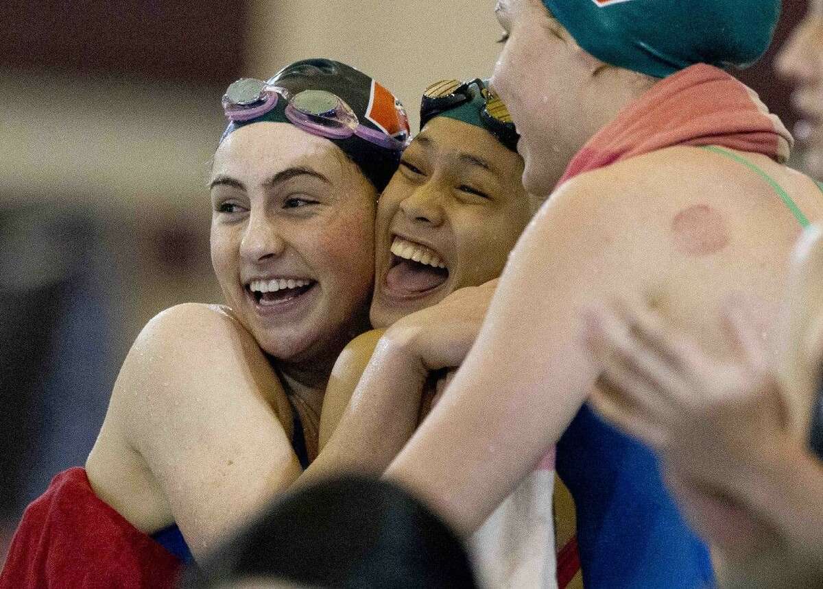 The Woodlands celebrating after winning the girls 200-yard medley relay during the Region 4-6A Swimming and Diving Championships Feb. 6, 2016, in Shenandoah. To purchase this photos, and others like it; go to HCNpics.com.