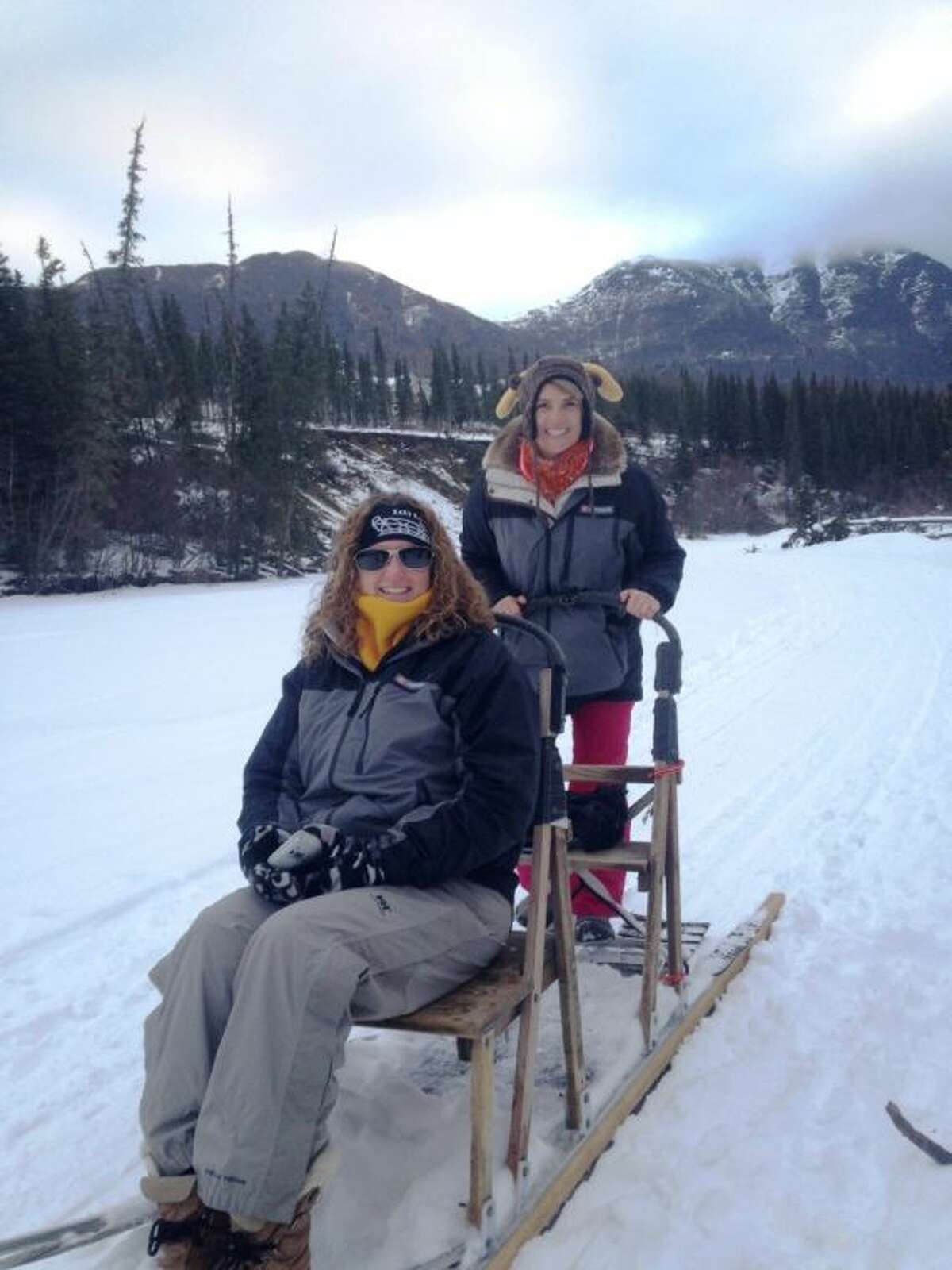 Tough Elementary teachers Theresa Robertson and Katy Sue Traicoff go for a sled ride Friday during the 2014 Iditarod Winter Conference for Educators in Alaska.
