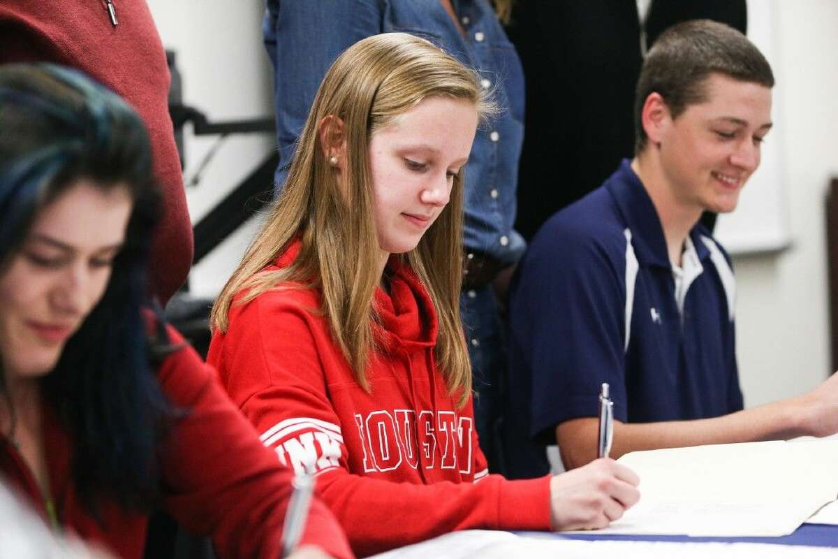 College Park’s Isabel Tank signs with the University of Houston during a Signing Day ceremony on Wednesday at College Park High School.