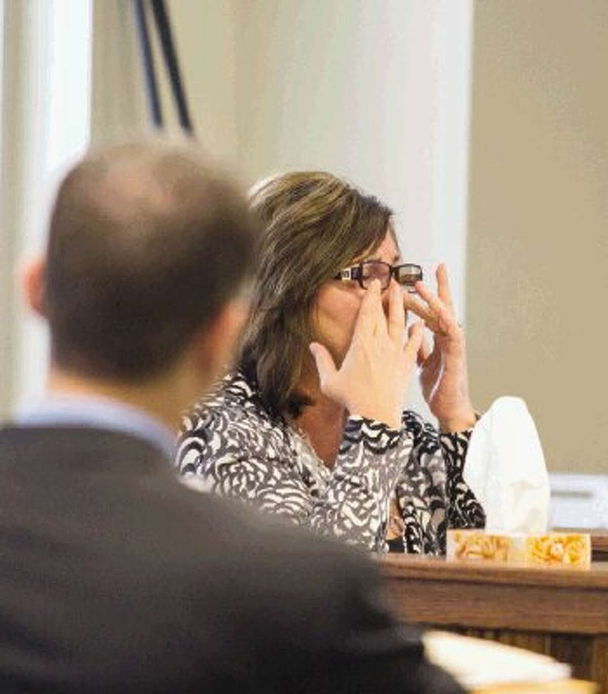 Laura Thomason, one of the first to see Robert Middleton after he was set on fire, wipes tears from her eyes during a hearing petition at the 359th Judicial District Court with Judge Kathleen Hamilton presiding in Conroe Monday. Don Willburn Collins is accused of murdering Middleton by setting him on fire in 1998.