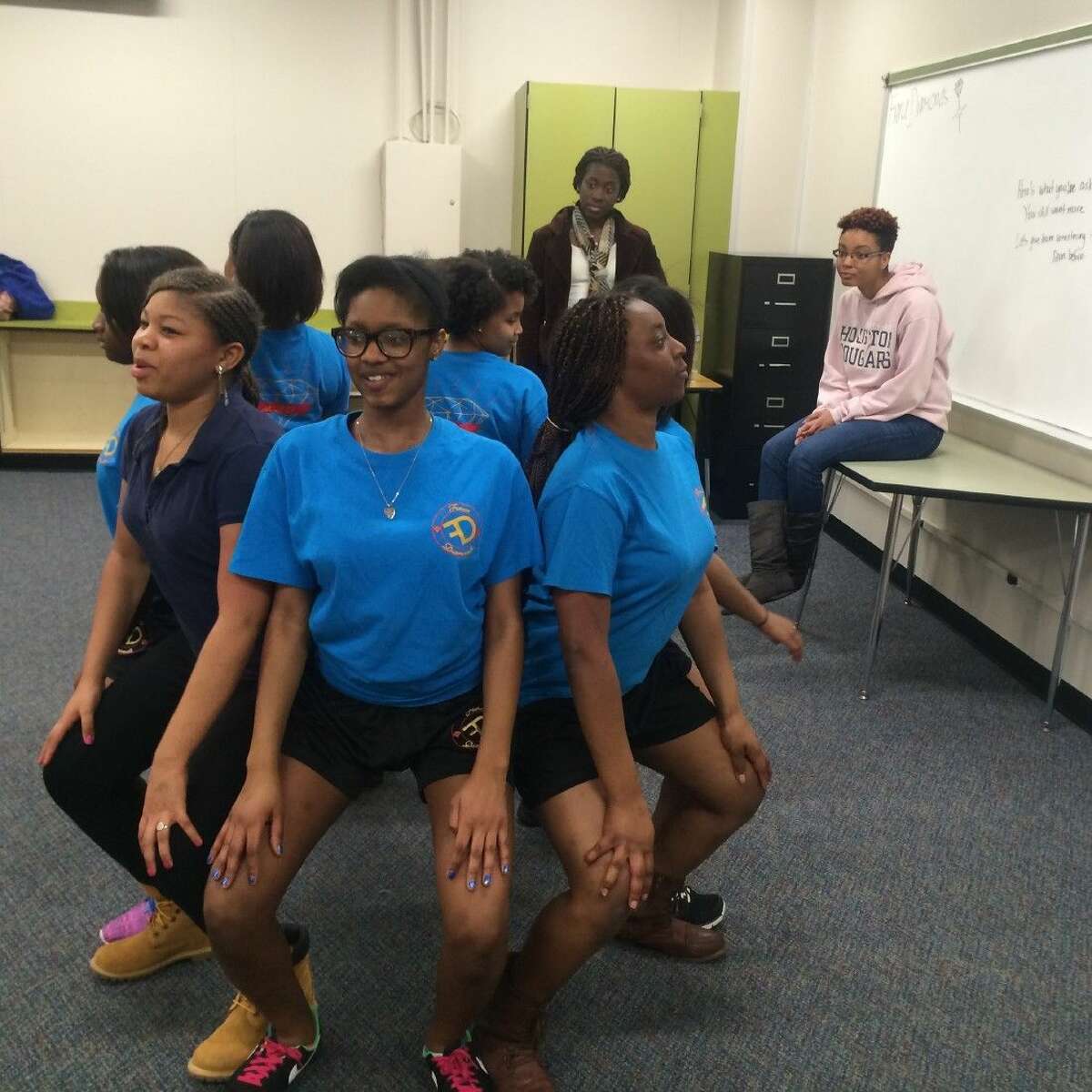 Members of the Fierce Diamonds step team focus on getting their routine down for upcoming performances.