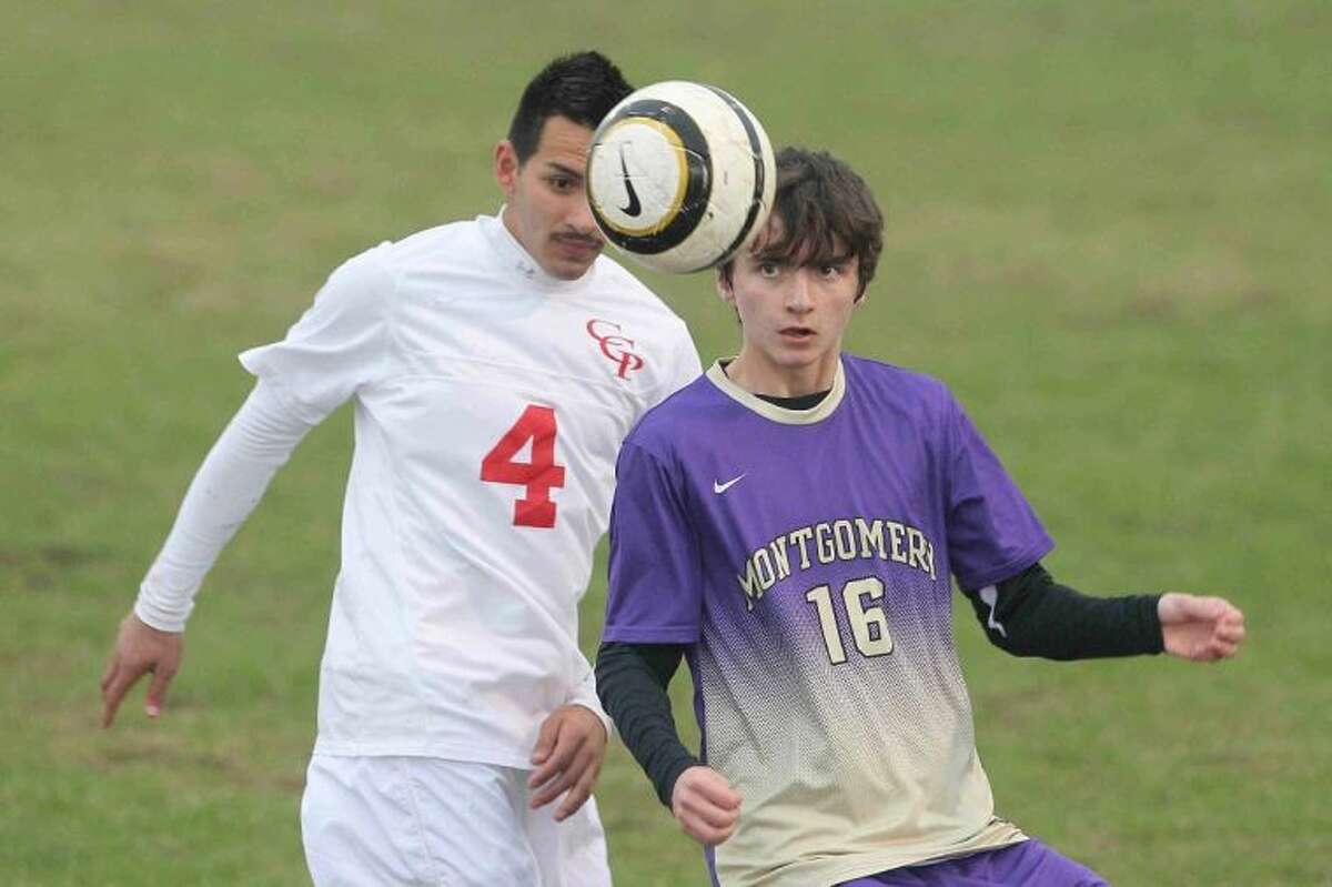 Caney Creek’s Francisco Lopez and Montgomery’s Tyler Nenninger look to control the ball during a District 39-4A match on Wednesday in Grangerland. To view or purchase this photo and others like it, visit HCNpics.com.