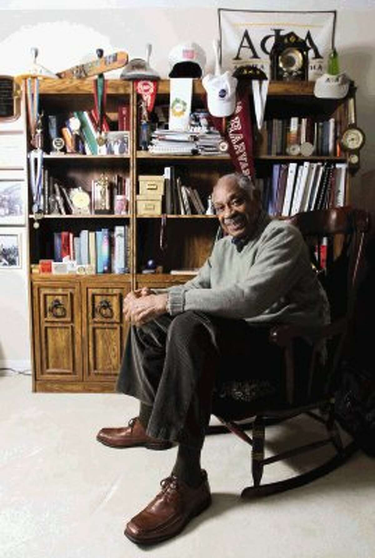 Lynwood Randolph, co-honored as Lone Star College-Montgomery’s recipient of 2014 Black History Month Outstanding Community Leadership Award, poses for a portrait in his study Feb. 27. Randolph, a graduate of Harvard University’s Business Leadership Development Program and scholar in the areas of math, physics and the sciences, served for seven years as the chairman of judges for the Conroe ISD Science Fair, among many volunteer achievements.