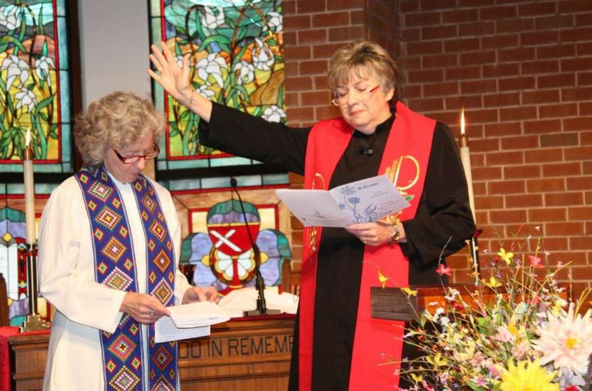 Rev. Hope Attenhofer, left, is installed as pastor of First Christian Church in Conroe during the installation ceremony Sunday afternoon.
