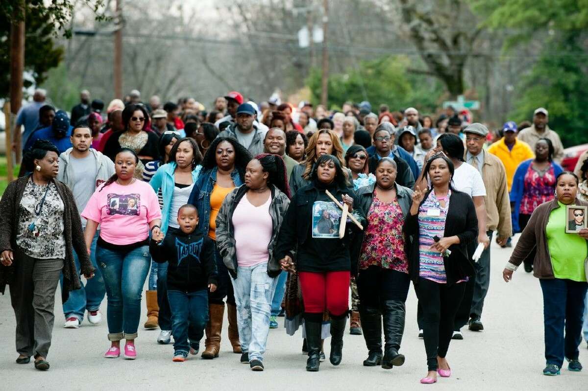 Family and friends of Da’Coreyan Blankenship march from Bethel Temple to Aurel Avenue for a candlelight vigil Wednesday in Longview.
