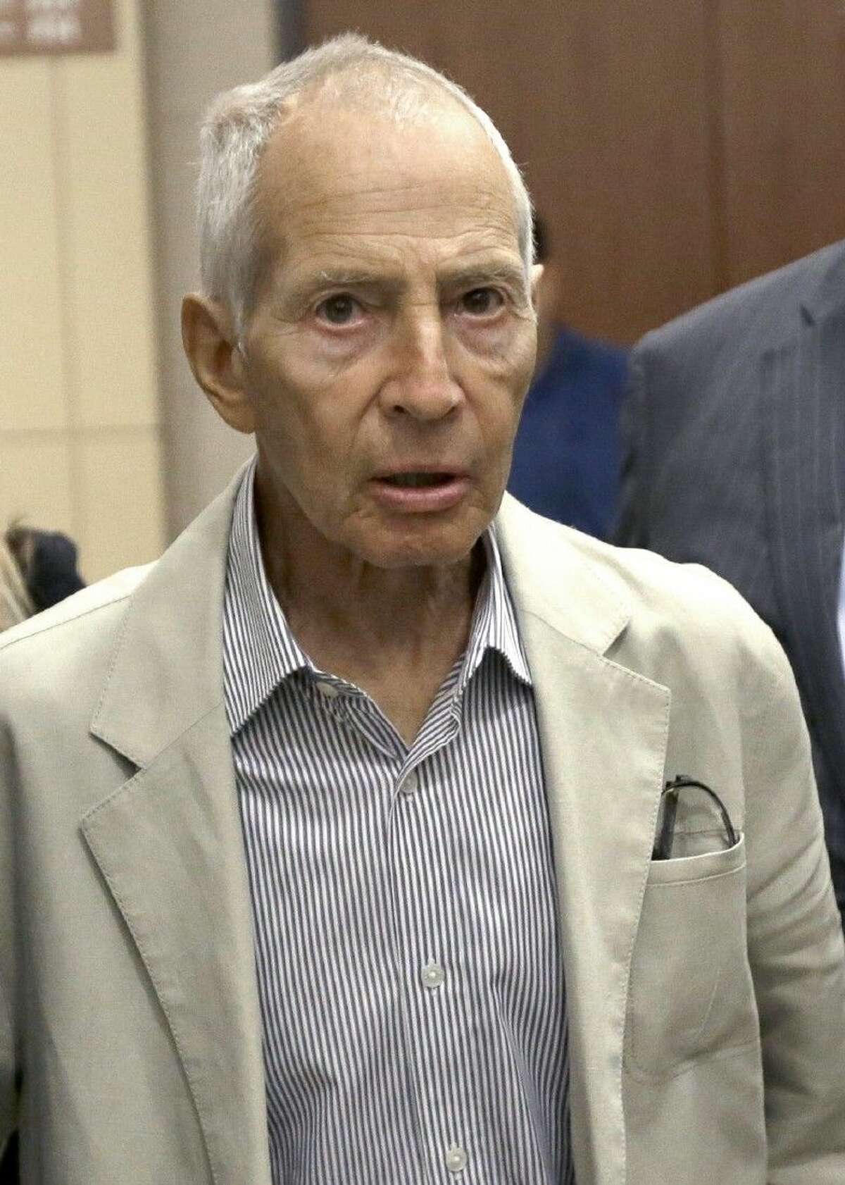 In this Aug. 15, 2014 file photo, New York City real estate heir Robert Durst leaves a Houston courtroom. Durst was arrested on a murder warrant just before Sunday evening’s finale of an HBO serial documentary about his links to three sensational killings. In the finale he said he “killed them all.”