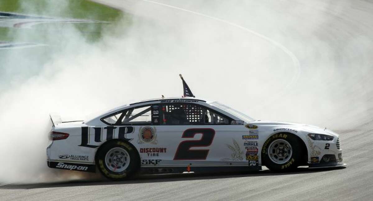 Brad Keselowski does a burnout after winning a NASCAR Sprint Cup Series auto race in Las Vegas.