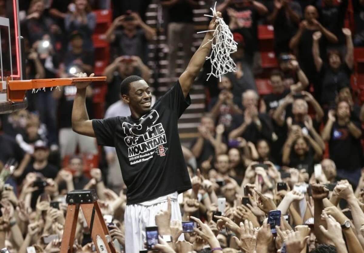 San Diego State’s Xavier Thames celebrates after San Diego State defeated New Mexico 51-48 to win the Mountain West Conference title on Saturday in San Diego.