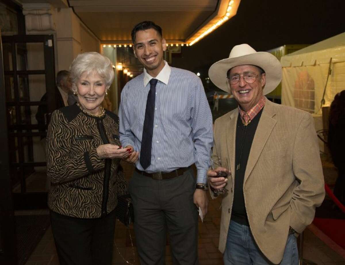 Barbara Bouma, left, receives the car keys from Sewell Maserati representative, Miguel Alvarado, center, as The People’s Critic columnist David Dow Bentley III looks on at Saturday night’s Bach, Beethoven & Barbecue fundraiser prior to the 30th Anniversary Young Texas Artists Music Competition Finalists’ Concert. Bouma, of The Woodlands, had the winning bid for the use of a brand new model — the Maserati Ghibli — for a Friday through Monday “weekend- of-your-choice” from Sewell Maserati.