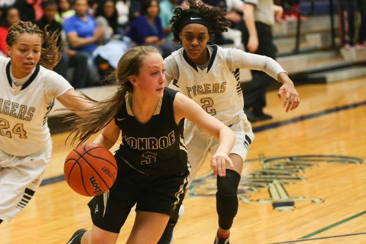 Conroe's Logan Magee (3) rebounds the ball during the high school girls basketball game against Klein Collins on Monday, Feb. 15, 2016, at College Park High School. To view more photos from the game, go to HCNPics.com.