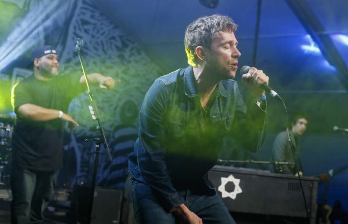 Damon Albarn, right, joined by De La Soul's Vincent Mason, left, performs during the SXSW Music Festival Friday in Austin.