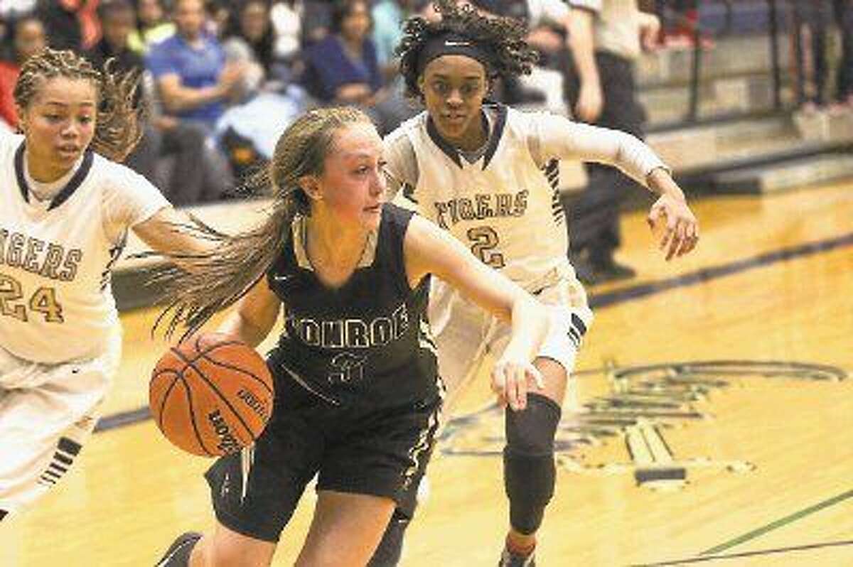 Conroe’s Logan Magee (3) rebounds the ball during the high school girls basketball game against Klein Collins on Monday at College Park High School.