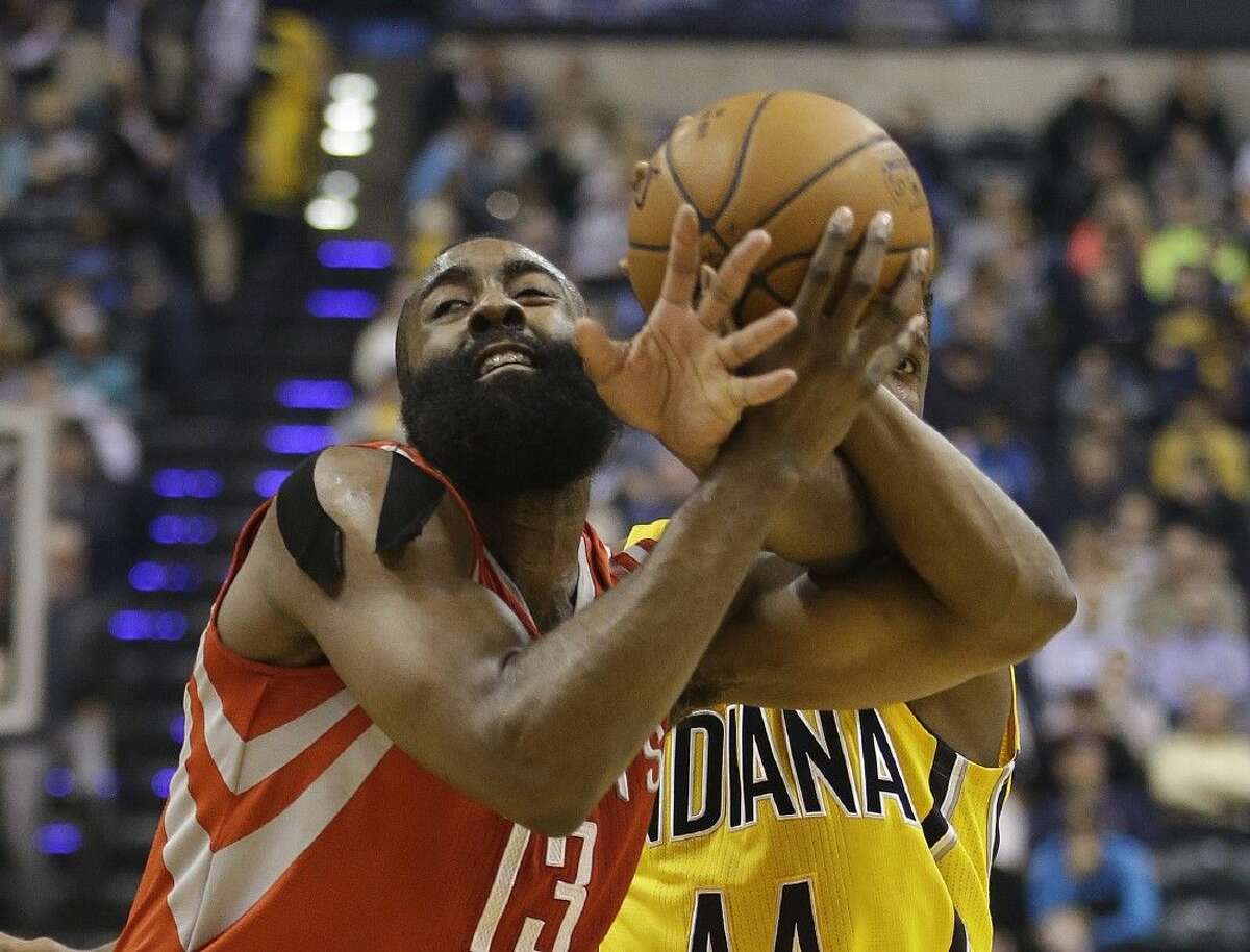 The Houston Rockets' James Harden draws a foul on his way to the basket in Monday’s victory over the Pacers.