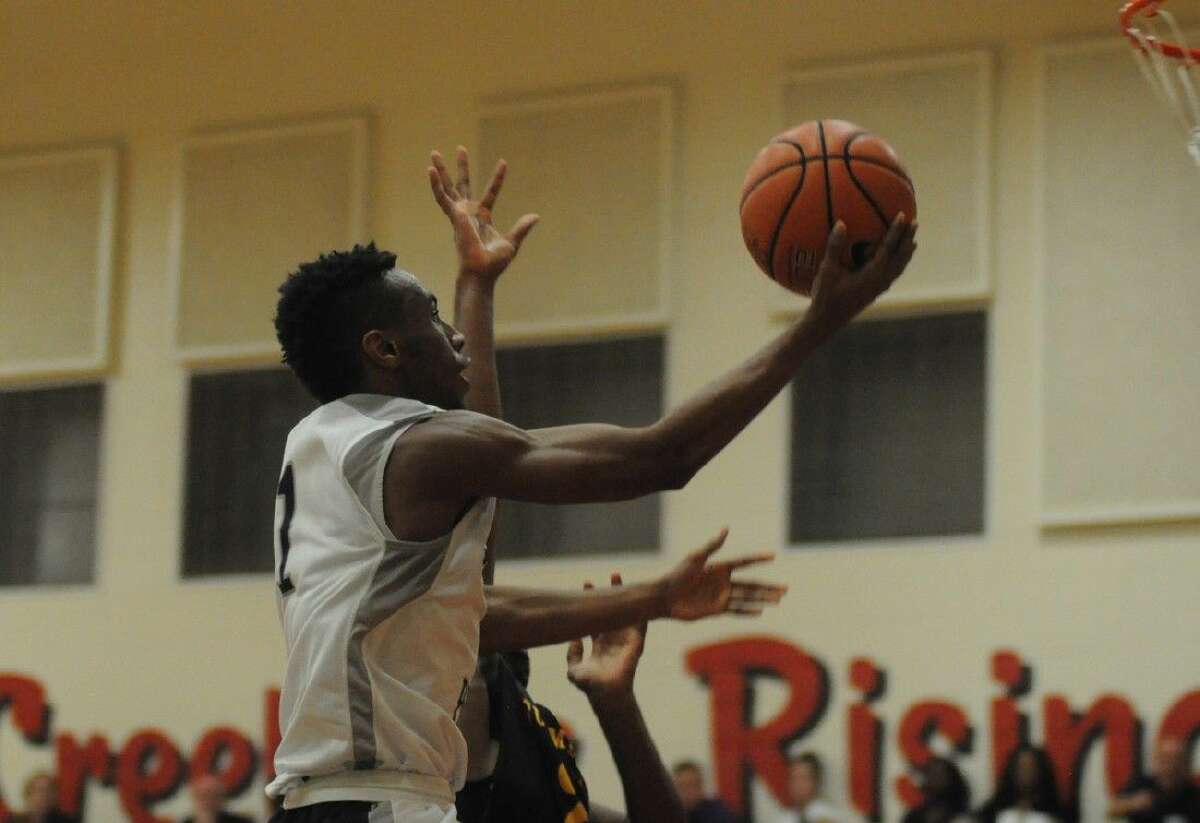 College Park's McKinley Green goes up for a layup against Summer Creek at Caney Creek High School on Friday.