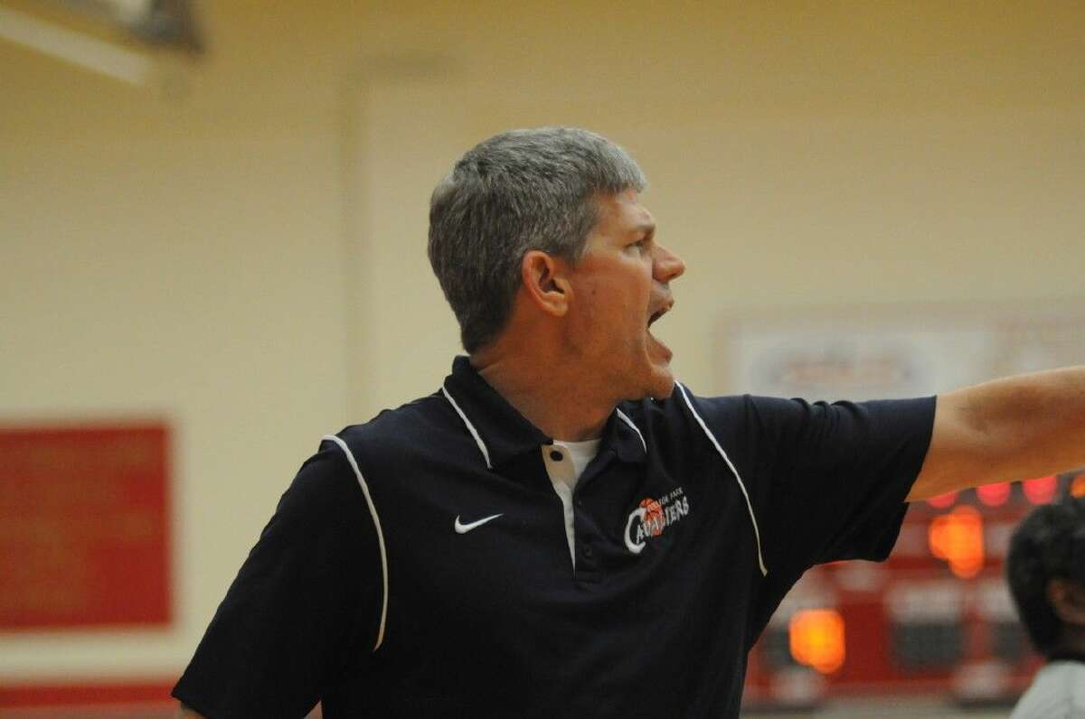 College Park coach Clifton McNeely directs his team against Summer Creek at Caney Creek High School on Friday.