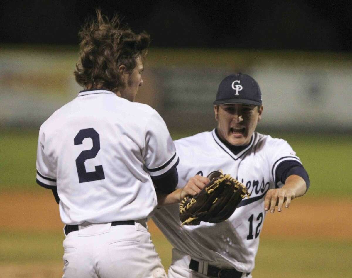 College Park pitcher Beau Ridgeway celebrate after the final out of a District 16-6A baseball game against The Woodladnds Tuesday.