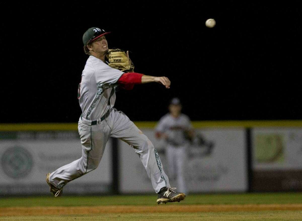 The Woodlands third baseman Justin Diehl throws midair to get out College Park's Noah Vaughan to end the sixth inning of a District 16-6A baseball game Tuesday.