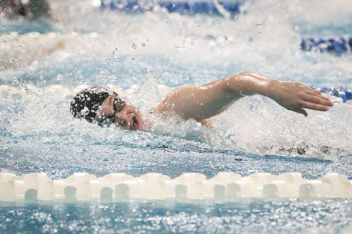 Magnolia’s Caitlin Clements, competes in the girls 100-yard freestyle during the Class 5A finals of the UIL State Swimming & Diving Championships at the Lee and Joe Jamaul Texas Swimming Center. To view this photos and others like it from the championships, go to HCNPics.com.