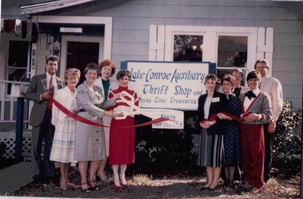 The Lake Conroe Auxiliary Assistance League of Houston’s first Thrift Shop at 1018 Houston Street in Conroe. Pictured is a Chamber of Commerce ribbon-cutting ceremony in 1985. Betty Oswald, in red, holds the scissors in the ribbon cutting. She was the group’s first president.