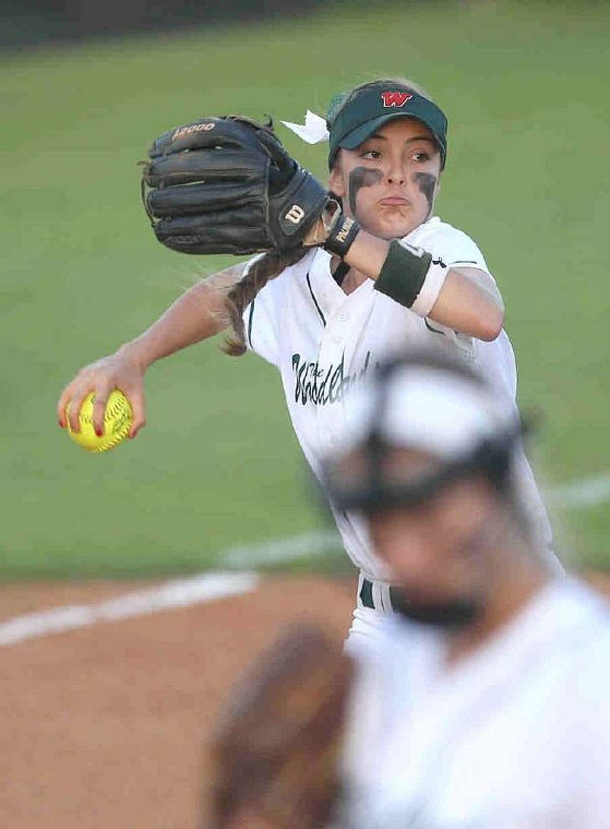 The Woodlands third baseman Kaitlyn Stavinoha throws to first during a high school softball game Tuesday. The Woodlands defeated College Park 3-1. To view or purchase this photo and others like it, visit HCNpics.com.