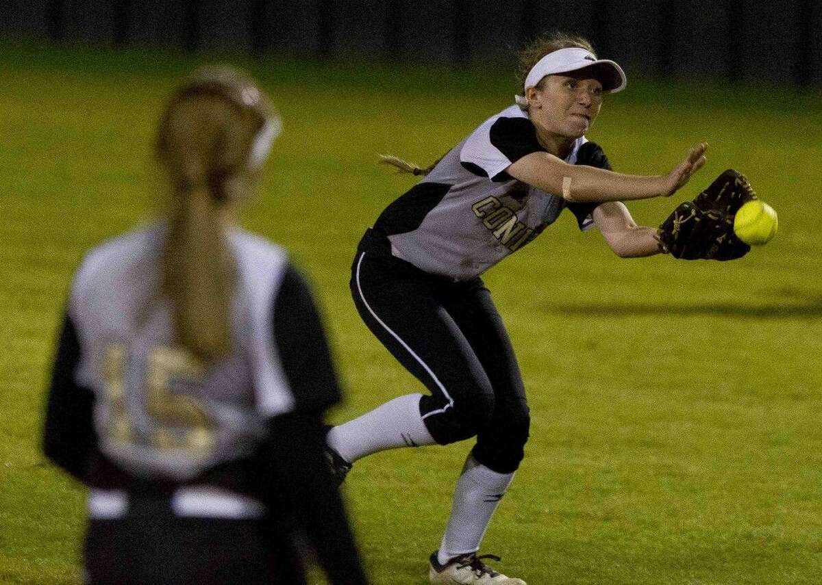 Conroe second baseman Macy Clevenger tries for a catch in the fifth inning of a District 16-6A softball game Wednesday.