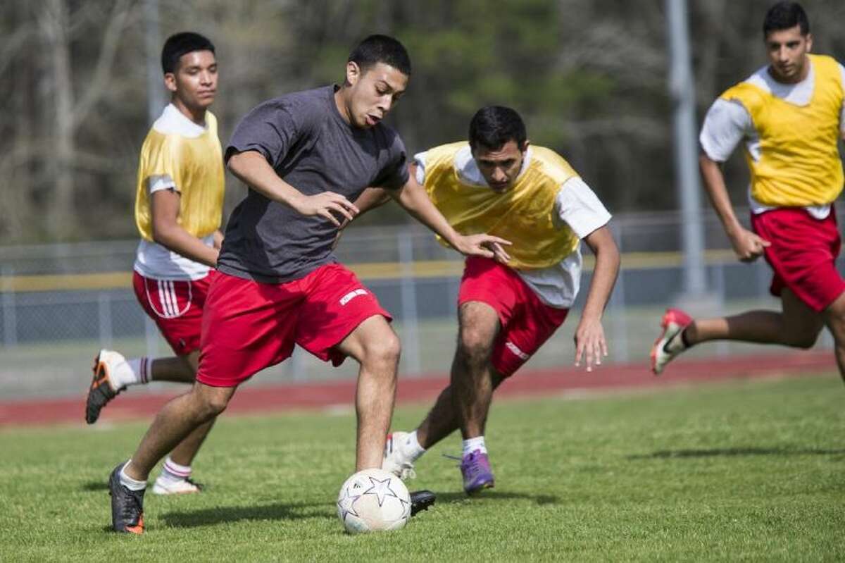 Splendora’s Chris Melendez dribbles upfield during practice on Wednesday. The Wildcats finished 12-0 in District 37-4A play this season.
