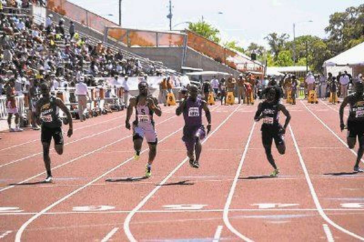Willis sprinter John Lewis, center, wins the Division II 100-meter dash at the Texas Relays on Saturday.