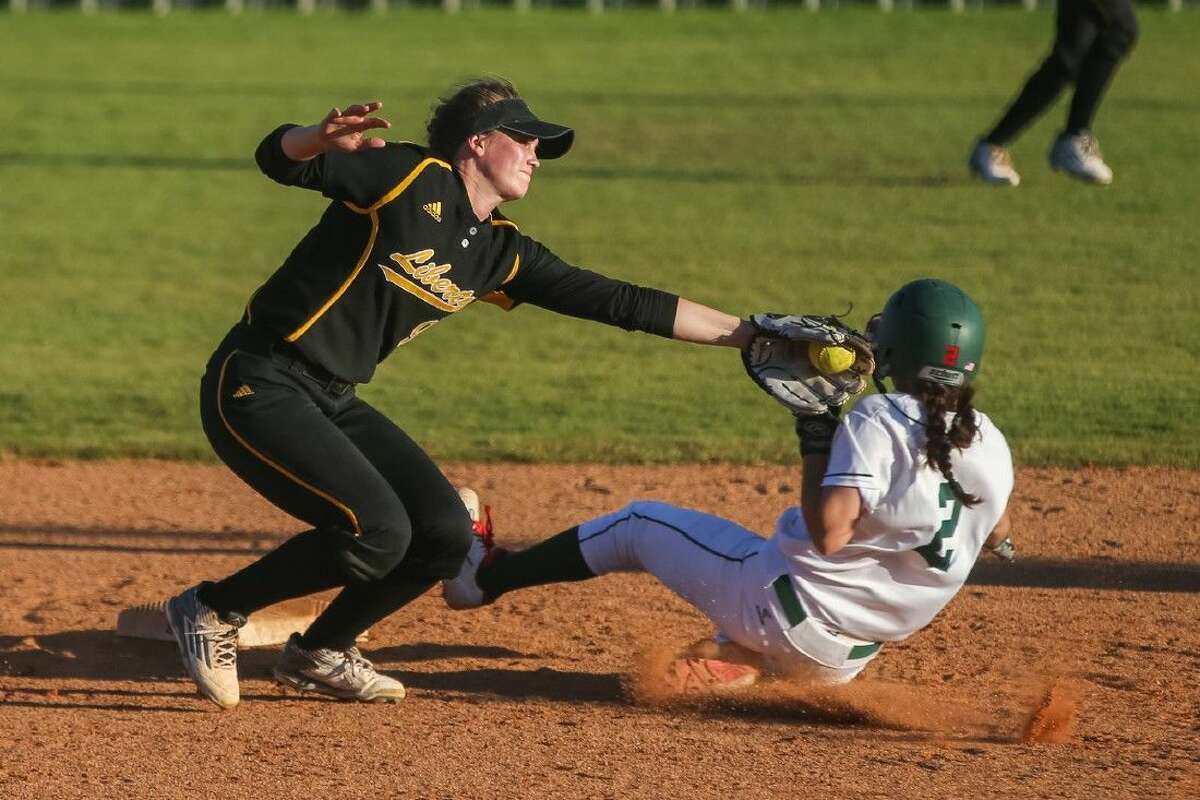 Liberty's Kamryn Parker tags The Woodlands' Abby Jones as she steals second base on Friday at The Woodlands High School.
